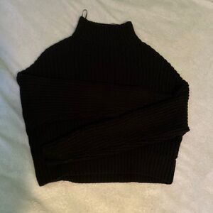 Black knitted and cropped turtleneck sweater